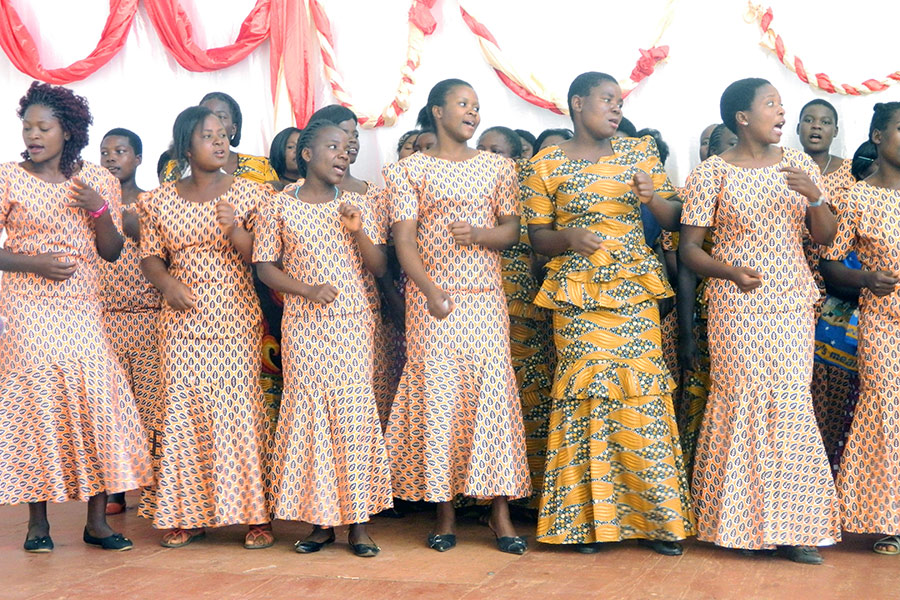 Training participants performing a song during the open day event