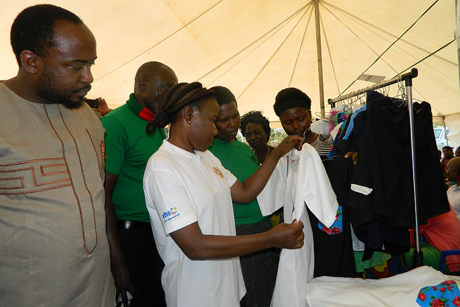 The Minister Of Civic Education Culture And Community Services Admires Some Of The Products Made By Tailoring Students