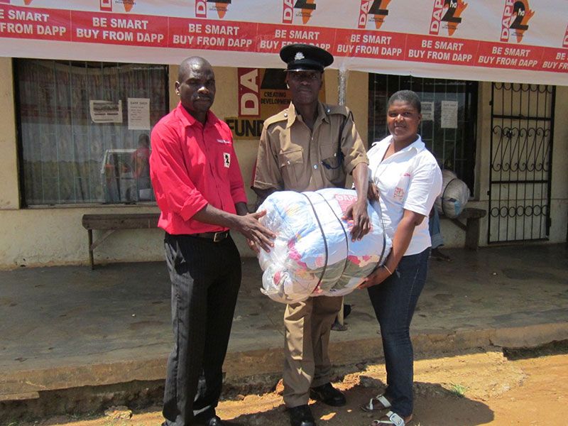 Malawi---C-S-a-customer-with-a-bale-of-cloths